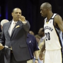 Memphis Grizzlies head coach Lionel Hollins, left, speaks to forward Quincy Pondexter (20) during the first half in Game 4 of the Western Conference finals NBA basketball playoff series  against the San Antonio Spurs, in Memphis, Tenn., Monday, May 27, 2013. (AP Photo/Danny Johnston)