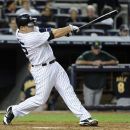 New York Yankees' Russell Martin hits the game-winning home run off Oakland Athletics relief pitcher Sean Doolittle during 10th inning of a baseball game Friday, Sept. 21, 2012, at Yankee Stadium in New York. (AP Photo/Kathy Kmonicek)