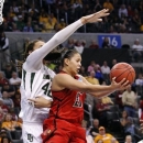 Louisville guard Shoni Schimmel (23) takes a reverse shot over Baylor's Brittney Griner (42) during the second half of a regional semifinal in the women's NCAA college basketball tournament in Oklahoma City, Sunday, March 31, 2013. Louisville won 82-81. (AP Photo/Alonzo Adams)