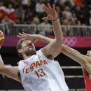 China's Yi Jianlian, right, tries to block Spain's Marc Gasol during a men's basketball game at the 2012 Summer Olympics, Sunday, July 29, 2012, in London. (AP Photo/Charles Krupa)