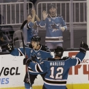 San Jose Sharks center Joe Pavelski (8) celebrates with center Patrick Marleau (12) after scoring against the Anaheim Ducks during the first period of an NHL hockey game in San Jose, Calif., Tuesday, Jan. 29, 2013. (AP Photo/Jeff Chiu)
