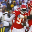 Kansas City Chiefs outside linebacker Tamba Hali (91) celebrates with teammates after returning a recovered fumble into the end zone for a touchdown past Buffalo Bills quarterback Jeff Tuel (7) during the second half of an NFL football game in Orchard Park, N.Y., Sunday, Nov. 3, 2013. (AP Photo/ Bill Wippert)