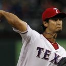 Texas Rangers starting pitcher Yu Darvish of Japan delivers to the Seattle Mariners in the first inning of a baseball game Friday, Sept. 14, 2012, in Arlington, Texas. (AP Photo/Tony Gutierrez)