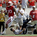 Wisconsin's James White heads to the end zone for a 51-yard touchdown run during the second half of an NCAA college football game against Massachusetts Saturday, Aug. 31, 2013, in Madison, Wis. Wisconsin won 45-0. (AP Photo/Morry Gash)