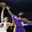 Golden State Warriors' David Lee (10) vies for a rebound against Los Angeles Lakers' Jodie Meeks (20) during the first half of an NBA basketball game in Oakland, Calif., Saturday, Dec. 22, 2012. (AP Photo/Marcio Jose Sanchez)