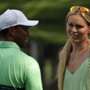 U.S. golfer Tiger Woods and girlfriend Lindsey Vonn smile during the par 3 event held ahead of the 2015 Masters at Augusta National Golf Course in Augusta, Georgia April 8, 2015.  REUTERS/Phil Noble
