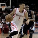 Houston Rockets' Jeremy Lin (7) drives the ball around Memphis Grizzlies' Mike Conley Jr. during the second half of a preseason NBA basketball game Wednesday, Oct. 17, 2012, in Houston. (AP Photo/Pat Sullivan)