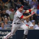 Washington Nationals' Ryan Zimmerman (11) follows through with a three-run double in the seventh inning of a baseball game against the Atlanta Braves, Friday, May 25, 2012, in Atlanta. (AP Photo/John Bazemore)