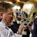 Notre Dame head coach Brian Kelly talks to Robby Toma during the first half of the BCS National Championship college football game against Alabama Monday, Jan. 7, 2013, in Miami. (AP Photo/Chris O'Meara)