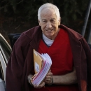 FILE - In this Jan. 10, 2013, file photo, former Penn State assistant football coach Jerry Sandusky arrives at the Centre County Courthouse for a post-sentencing hearing in Bellefonte, Pa. A lawyer says his client is the first to settle a civil claim against Penn State related to the Sandusky child sexual abuse case. Attorney Tom Kline confirmed in an email that the client known as Victim 5 when he testified at Sandusky's criminal trial has agreed to terms with the university. (AP Photo/Gene J. Puskar, File)