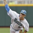 UCLA's starting pitcher Adam Plutko works against Stony Brook in the first inning of an NCAA College World Series baseball game in Omaha, Neb., Friday, June 15, 2012. (AP Photo/Nati Harnik)