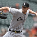 Chicago White Sox pitcher Chris Sale delivers against the Baltimore Orioles in the first inning of the first baseball game of a doubleheader Thursday, May 28, 2015, in Baltimore. (AP Photo/Gail Burton)