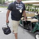 Indianapolis Colts offensive lineman carries some of his clothing and a television as he arrives as to the NFL team's football training camp in Anderson, Ind., Saturday, July 28, 2012. Practice begins Sunday. (AP Photo/Michael Conroy)