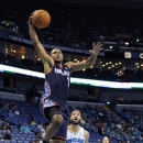 Charlotte Bobcats guard Ramon Sessions (7) drives to the basket in front of New Orleans Hornets guard Greivis Vasquez (21) during the first half of an NBA preseason basketball game in New Orleans, Tuesday, Oct. 9, 2012. (AP Photo/Gerald Herbert)
