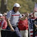 USA's Phil Mickelson gives a thumbs up as he walks up the third hole during a singles match at the Ryder Cup PGA golf tournament Sunday, Sept. 30, 2012, at the Medinah Country Club in Medinah, Ill. (AP Photo/David J. Phillip)