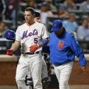 New York Mets David Wright (5) is escorted off the field by New York Mets manager Terry Collins after Wright was hit by a pitch in the third inning of a baseball game against the Milwaukee Brewers at Citi Field in New York, Thursday, Sept. 26, 2013. (AP Photo/Paul J. Bereswill)