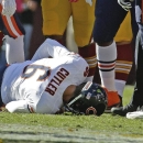 Chicago Bears quarterback Jay Cutler lies on the field after being injured in a sack by Washington Redskins defensive end Chris Baker during the first half of a NFL football game in Landover, Md., Sunday, Oct. 20, 2013. (AP Photo/Alex Brandon)