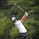 Adam Scott hits his second shot on the 10th hole during the pro-am round of the Deutsche Bank Championships in Norton, Mass., Thursday, Aug. 29, 2013. (AP Photo/Stew Milne)