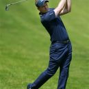 England's Luke Donald plays from the rough on the 4th hole during the final round of the PGA Championship at the Wentworth golf club, Virginia Water, England, Sunday May 27, 2012. (AP Photo/Tim Hales)