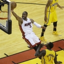 Miami Heat shooting guard Dwyane Wade (3) heads to the basket as Indiana Pacers shooting guard Lance Stephenson (1) looks on during the first half of Game 7 in their NBA basketball Eastern Conference finals playoff series, Monday, June 3, 2013 in Miami. (AP Photo/Wilfredo Lee)