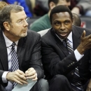 FILE- In this Dec. 17, 2011, file photo, New Jersey Nets head coach Avery Johnson, right, talks with assistant coach P.J. Carlesimo during the first half of an NBA preseason basketball game against the New York Knicks in Newark, N.J. The Nets fired Johnson on Thursday, Dec. 27, 2012, and Carlesimo will coach the team on an interim basis, starting Friday night with a home game against Charlotte. (AP Photo/Mel Evans, File)