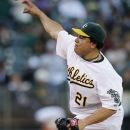 Oakland Athletics' Bartolo Colon works against the Los Angeles Angels in the first inning of a baseball game, Tuesday, Aug. 7, 2012, in Oakland, Calif. (AP Photo/Ben Margot)