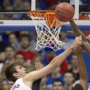 Kansas center Jeff Withey (5) blocks a shot by San Jose State forward Chris Cunningham (15) during the first half of an NCAA college basketball game in Lawrence, Kan., Monday, Nov. 26, 2012. (AP Photo/Orlin Wagner)