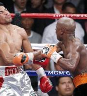 Floyd Mayweather delivers a knockout punch to Victor Ortiz in the fourth round during a WBC welterweight title fight, Saturday, Sept. 17, 2011, in Las Vegas.