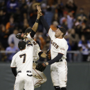 San Francisco Giants center fielder Gregor Blanco (7), center fielder Angel Pagan, rear, and right fielder Hunter Pence celebrate after the Giants beat the Los Angeles Dodgers in a baseball game in San Francisco, Wednesday, Sept. 25, 2013. The Giants won 6-4. (AP Photo/Jeff Chiu)