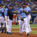 Tampa Bay Rays starting pitcher Enny Romero, right, walks back to the dugout after being taken off the mound by Rays' manager Joe Maddon, third from left, during the fifth inning of a baseball game Sunday, Sept. 22, 2013, in St. Petersburg, Fla. (AP Photo/Brian Blanco)