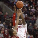 Ohio State's Deshaun Thomas, right, goes up for a shot over Nebraska's Dylan Talley during the second half of an NCAA college basketball game in Columbus, Ohio, Wednesday, Jan. 2, 2013. Ohio State won 70-44. (AP Photo/Paul Vernon)