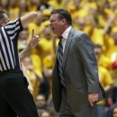 Kansas head coach Bill Self, right, receives a technical foul early in the first half of an NCAA college basketball game against Iowa State, Monday, Feb. 25, 2013, in Ames, Iowa. (AP Photo/Justin Hayworth)
