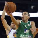 Maccabi Haifa's Paul Stoll shoots as Golden State Warriors' Stephen Curry guards during the first half of an NBA exhibition basketball game in Oakland, Calif., Thursday, Oct. 11, 2012. (AP Photo/George Niktin)