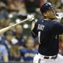 Milwaukee Brewers' Corey Hart watches his three-runhome run against the Houston Astros during the third inning of a baseball game Saturday, Sept. 29, 2012, in Milwaukee. (AP Photo/Jeffrey Phelps)