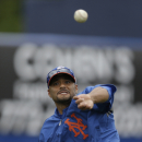 New York Mets starting pitcher Johan Santana throws while working out before an exhibition spring training baseball game Detroit Tigers, Friday, March 1, 2013, in Port St. Lucie, Fla.  (AP Photo/Julio Cortez)