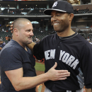 New York Yankees relief pitcher Mariano Rivera, right, greets former teammate Chuck Knoblauch before a baseball game against the Houston Astros Saturday, Sept. 28, 2013, in Houston. Rivera is in the final games of his retirement tour after a 19-year playing career. (AP Photo/Pat Sullivan)
