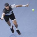 Tomas Berdych of the Czech Republic returns the ball to Milos Raonic of the Canada during their semifinal match at the ATP World Tour Masters tennis tournament at Bercy stadium in Paris, France, Saturday, Nov. 1, 2014. (AP Photo/Jacques Brinon)