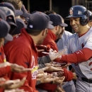 St. Louis Cardinals' Carlos Beltran (3) is congratulated in the dugout after hitting a two-run home run during the fourth inning in Game 1 of baseball's National League championship series against the San Francisco Giants Sunday, Oct. 14, 2012, in San Francisco. (AP Photo/David J. Phillip)