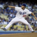 Los Angeles Dodgers starter Clayton Kershaw pitches to the Washington Nationals in the first inning of a baseball game in Los Angeles Tuesday, May 14, 2013. (AP Photo/Reed Saxon)