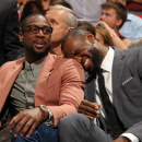 MIAMI, FL - APRIL 2: Dwyane Wade #3 and LeBron James #6 of the Miami Heat share a moment against the New York Knicks during a game on April 2, 2013 at American Airlines Arena in Miami, Florida. (Photo by Issac Baldizon/NBAE via Getty Images)