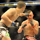 Myles Jury lands a punch on Diego Sanchez during a UFC 171 mixed martial arts lightweight bout, Saturday, March. 15, 2014, in Dallas. Jury won by decision. (AP Photo/Matt Strasen)