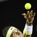 Rafael Nadal, of Spain, serves to Pablo Cuevas of Uruguay at the quarter-finals of the Rio Open tennis tournament in Rio de Janeiro, Brazil, early Saturday, Feb. 21, 2015. (AP Photo/Felipe Dana)