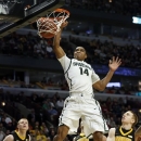 Michigan State's Gary Harris dunks during the second half of an NCAA college basketball game at the Big Ten tournament against Iowa Friday, March 15, 2013, in Chicago. Michigan State won 59-56. (AP Photo/Charles Rex Arbogast)