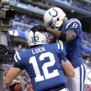 Indianapolis Colts' Andrew Luck, left, and Donnie Avery celebrate after Luck ran for a 5-yard touchdown run during the first half of an NFL football game against the Cleveland Browns, Sunday, Oct. 21, 2012, in Indianapolis. (AP Photo/AJ Mast)