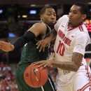 Ohio State's LaQuinton Ross, right, tries to dribble past Chicago State's Aaron Williams during the second half of an NCAA college basketball game on Saturday, Dec. 29, 2012, in Columbus, Ohio. Ohio State defeated Chicago State 87-44. (AP Photo/Jay LaPrete)