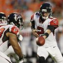 Atlanta Falcons quarterback Matt Ryan (2) hands the ball to running back Michael Turner (33) during the first half of an NFL preseason football game against the Miami Dolphins, Friday Aug. 24, 2012, in Miami. (AP Photo/Lynne Sladky)