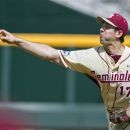 Florida State starting pitcher Mike Compton delivers against Stony Brook in the first inning of an NCAA College World Series elimination baseball game in Omaha, Neb., Sunday, June 17, 2012. (AP Photo/Nati Harnik)