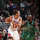 CHICAGO, IL - DECEMBER 18: Joakim Noah #13 of the Chicago Bulls gets ready to drive on Kevin Garnett #5 of the Boston Celtics on December 18, 2012 at the United Center in Chicago, Illinois. (Photo by Gregory Shamus/NBAE via Getty Images)