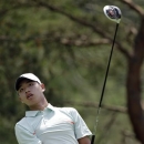 Amateur Guan Tianlang, of China, watches his tee shot on the second hole during the first round of the Memorial golf tournament Thursday, May 30, 2013, in Dublin, Ohio. (AP Photo/Jay LaPrete)