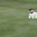 Greg Norman of Australia watches his shot during the first round of the Omega European Masters Golf Tournament in Crans Montana, Switzerland, Thursday, Aug. 30, 2012. (AP Photo/Keystone/Peter Klaunzer)